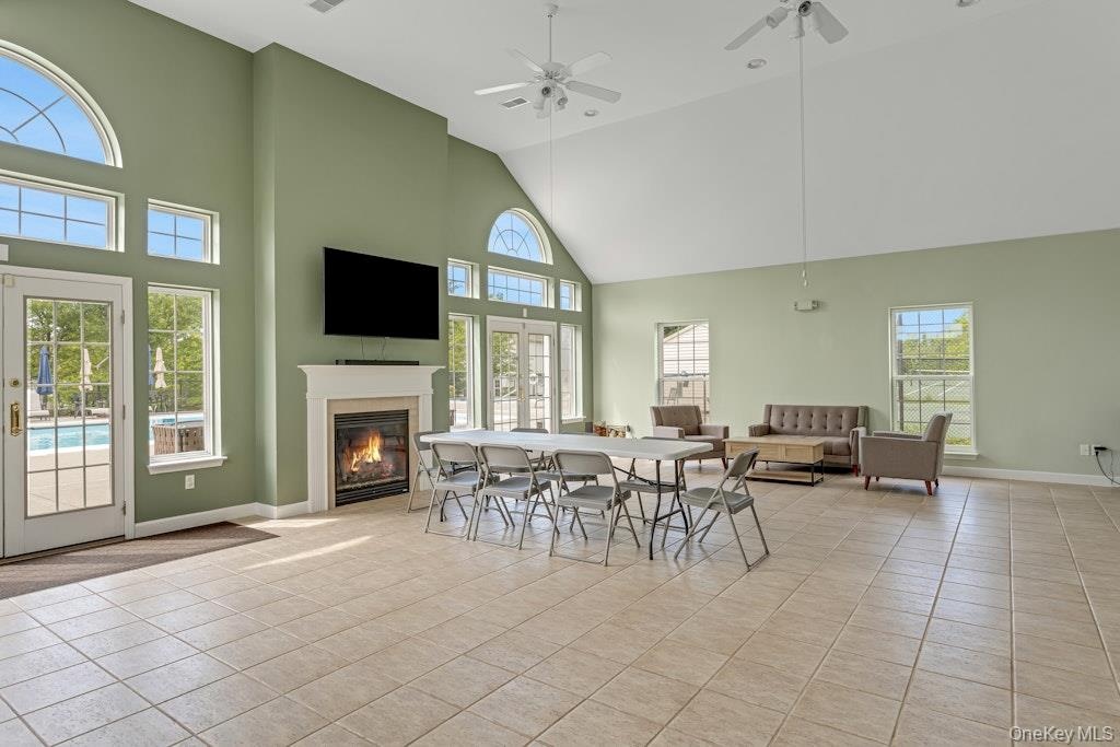 The main room of the clubhouse which is graced with a fireplace, is a bright, enormous space for,  community meetings, parties, etc. and can be rented