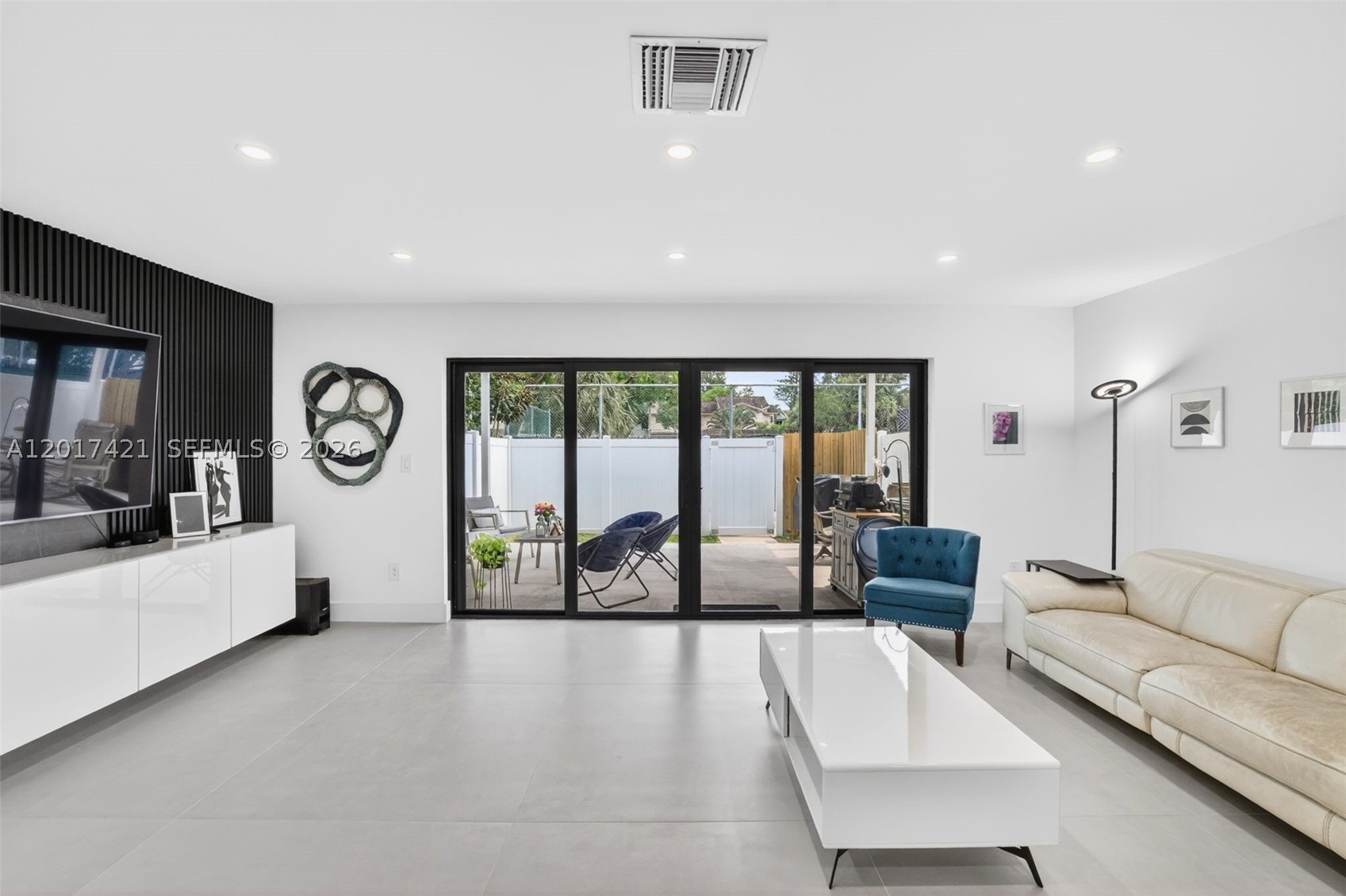 Oversized family room / great room (room for dining area as well (just move sofa closer to TV and add it behind)