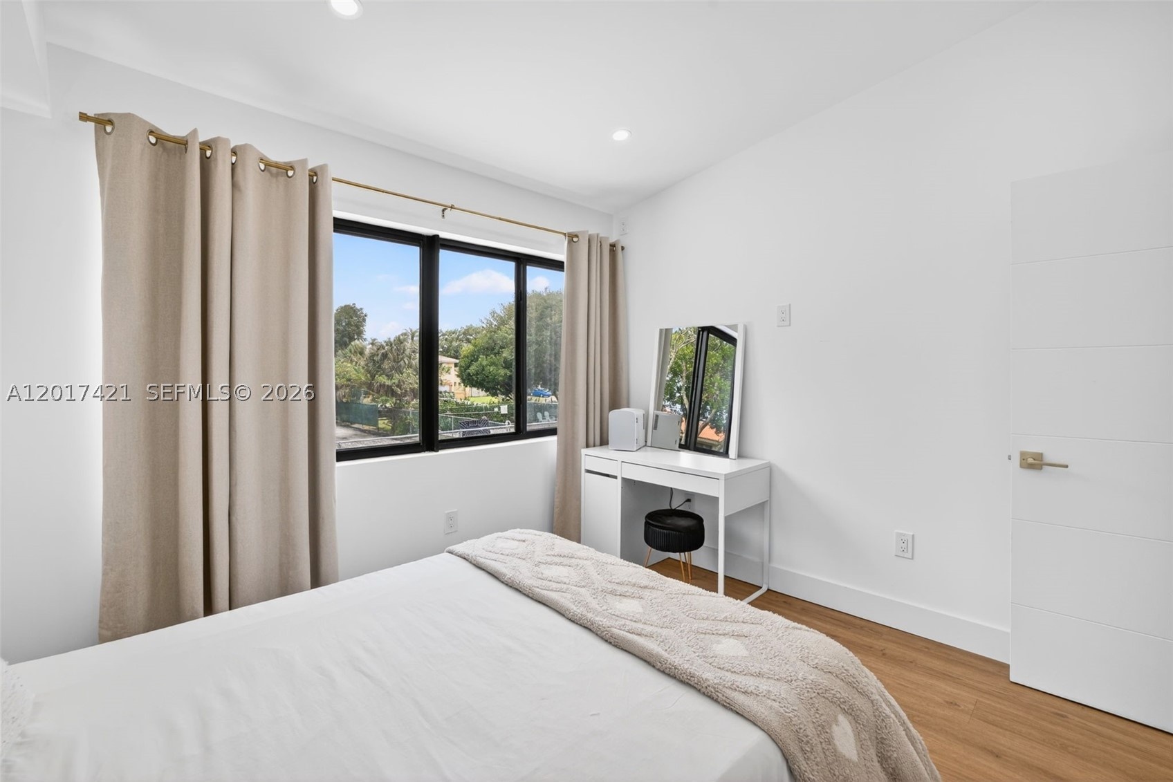 Larger guest bedroo upstairs, overlooks backyard