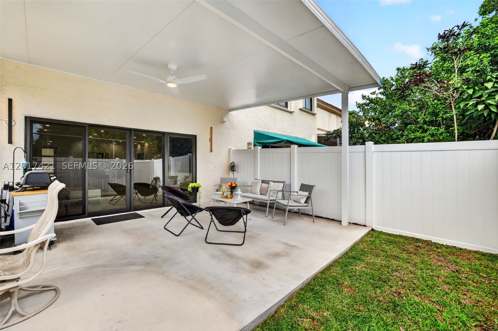 Fabulous backyard w/ new concrete pad and covered shade structure w/ fan to enjoy the backyard and weather
