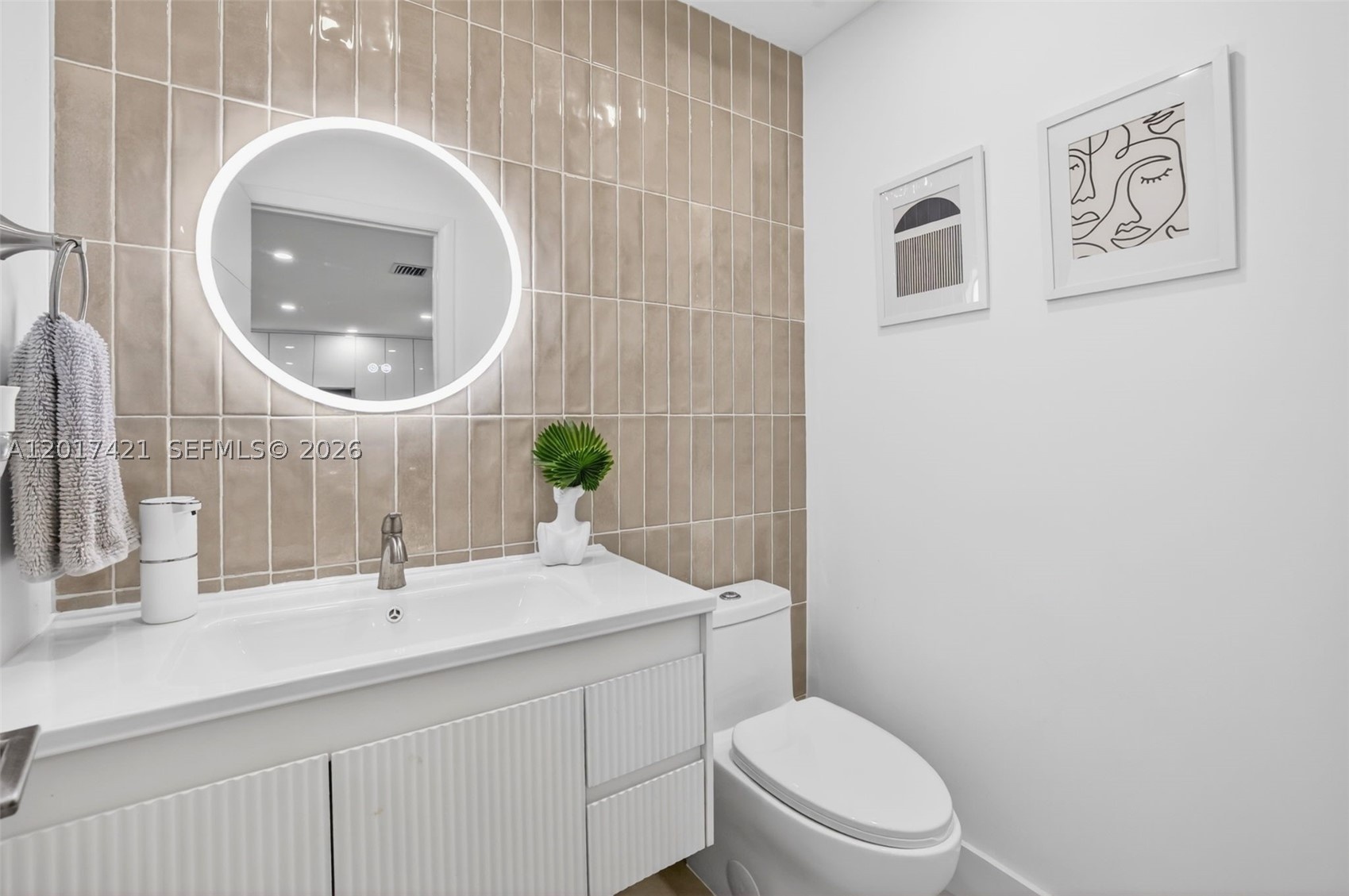 Upgraded powder room downstairs for the guests w/ feature wall