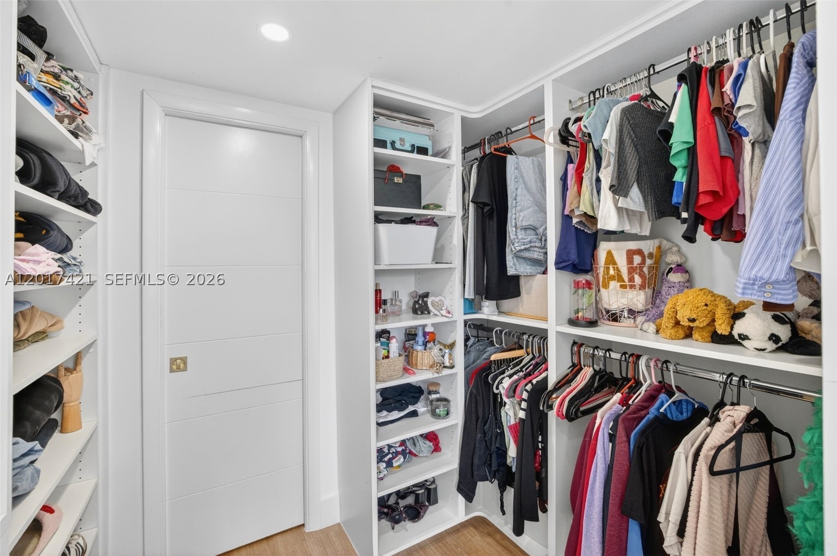 Walk through this aweosme closet to get to the en suite bathroom
