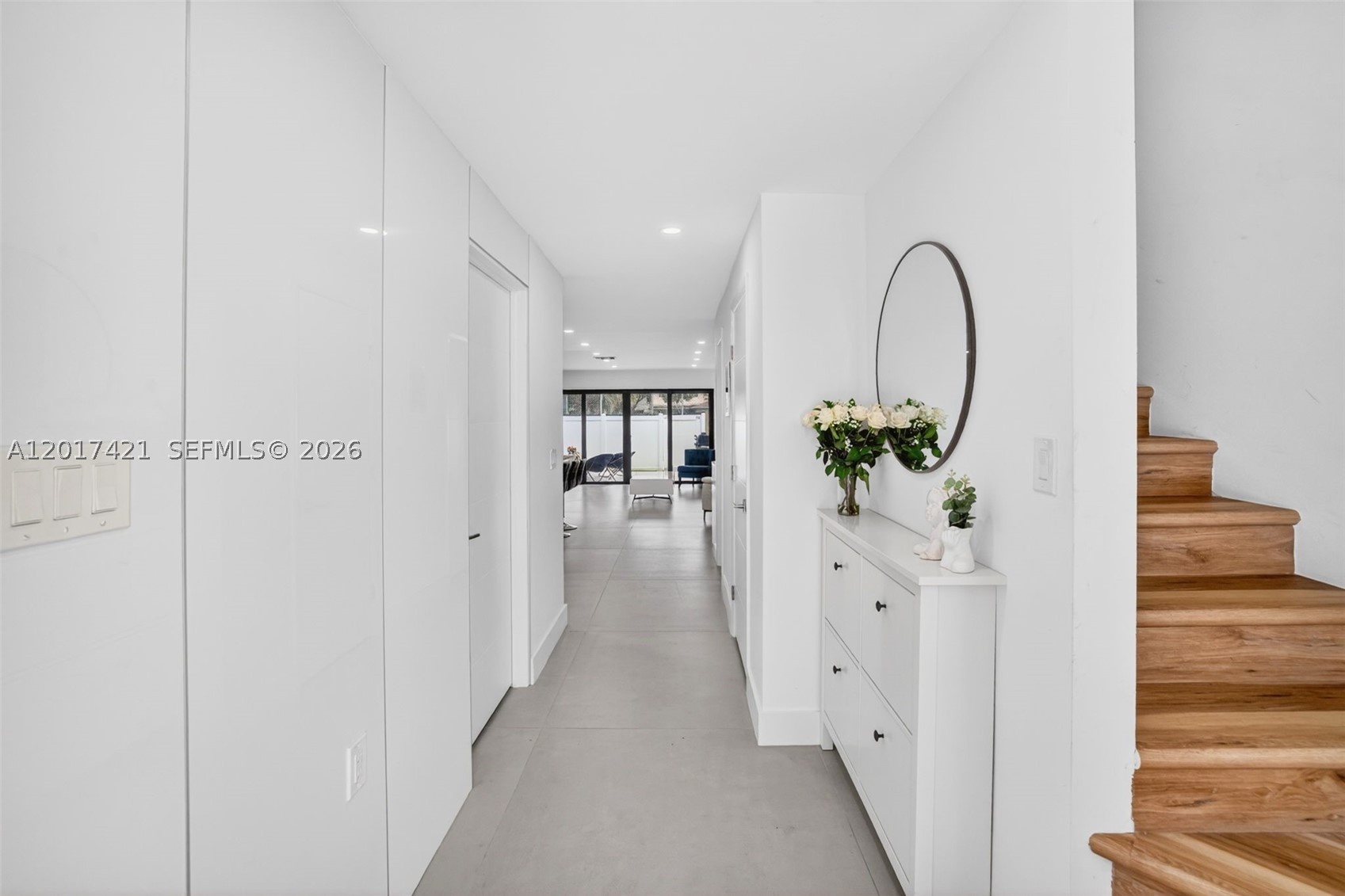 Foyer entrance with stairs leading up to 3 bedrooms & 2 bathrooms