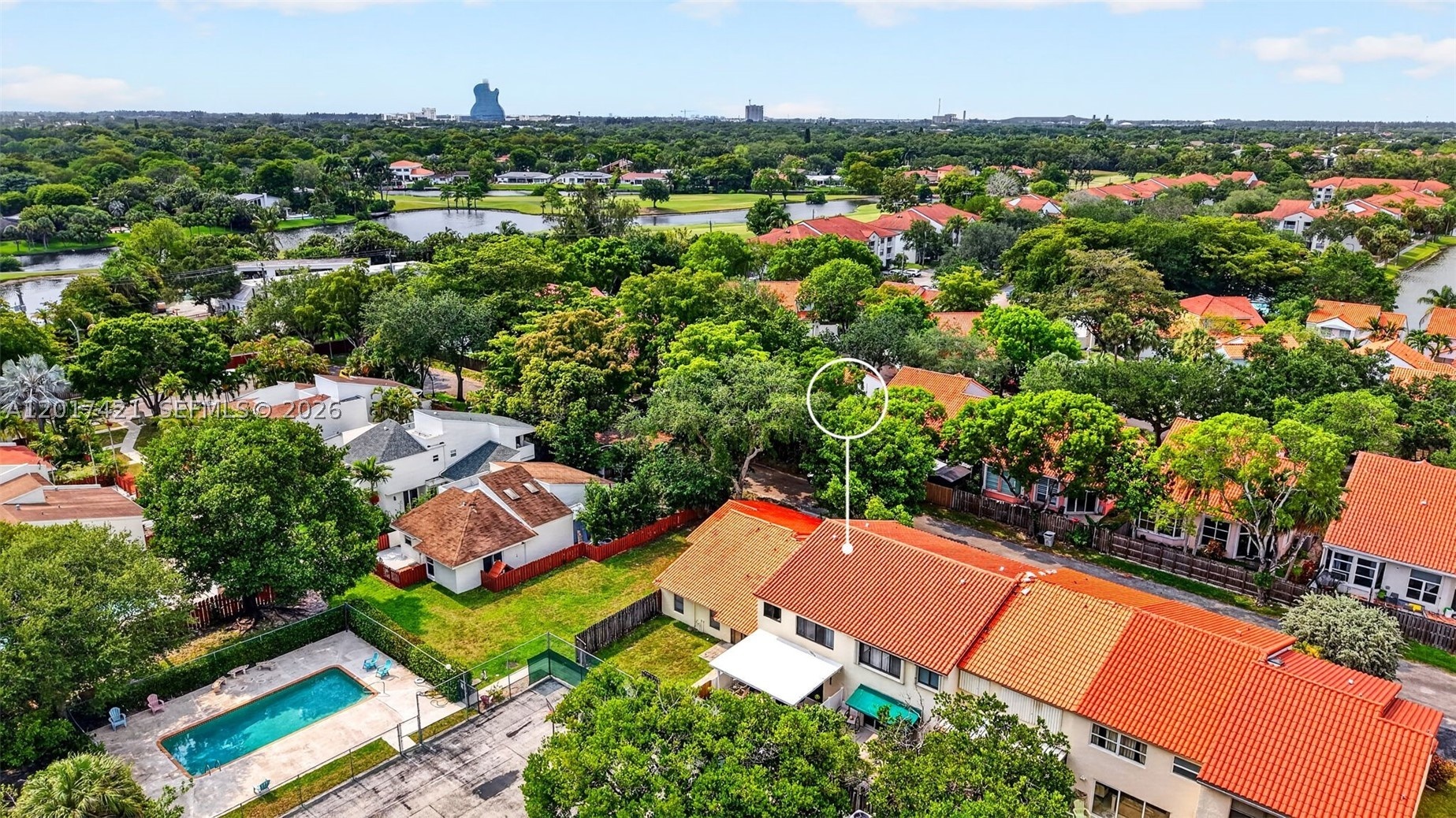 Check out the proximity to the Hard Rock Guitar Hotel. See community pool behind the property (and currently not in use tennis court). Tree lined comm