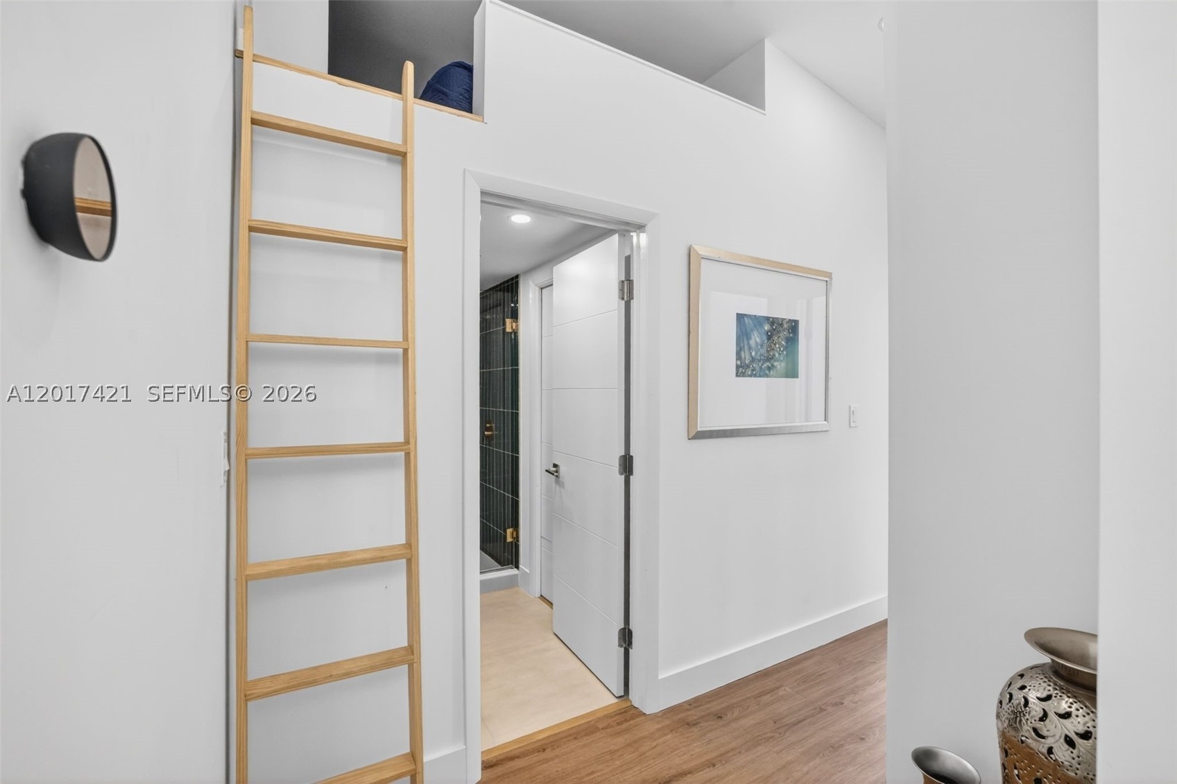 stairs to extra storage area, loft or hideaway space. View toward upstairs guest bathroom