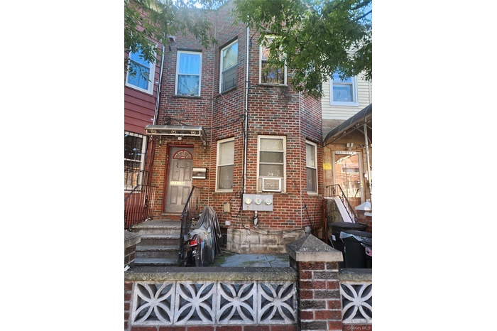 View of front of house with brick siding