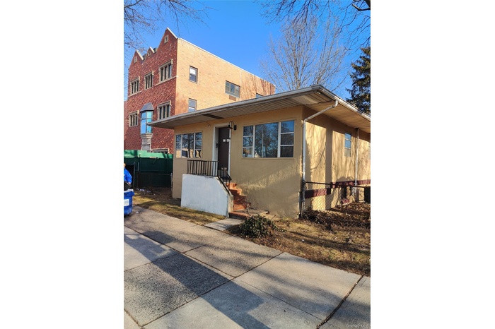View of front of home featuring stucco siding
