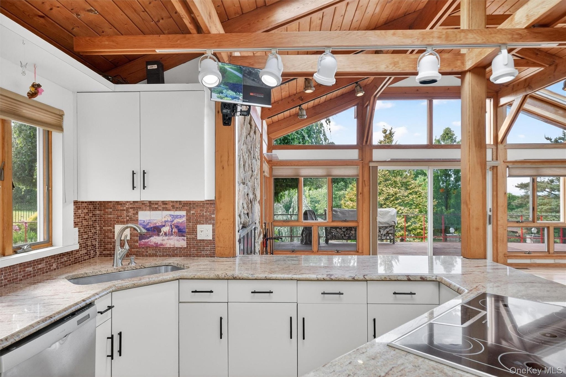 Open to the living room with stunning farm views and beyond