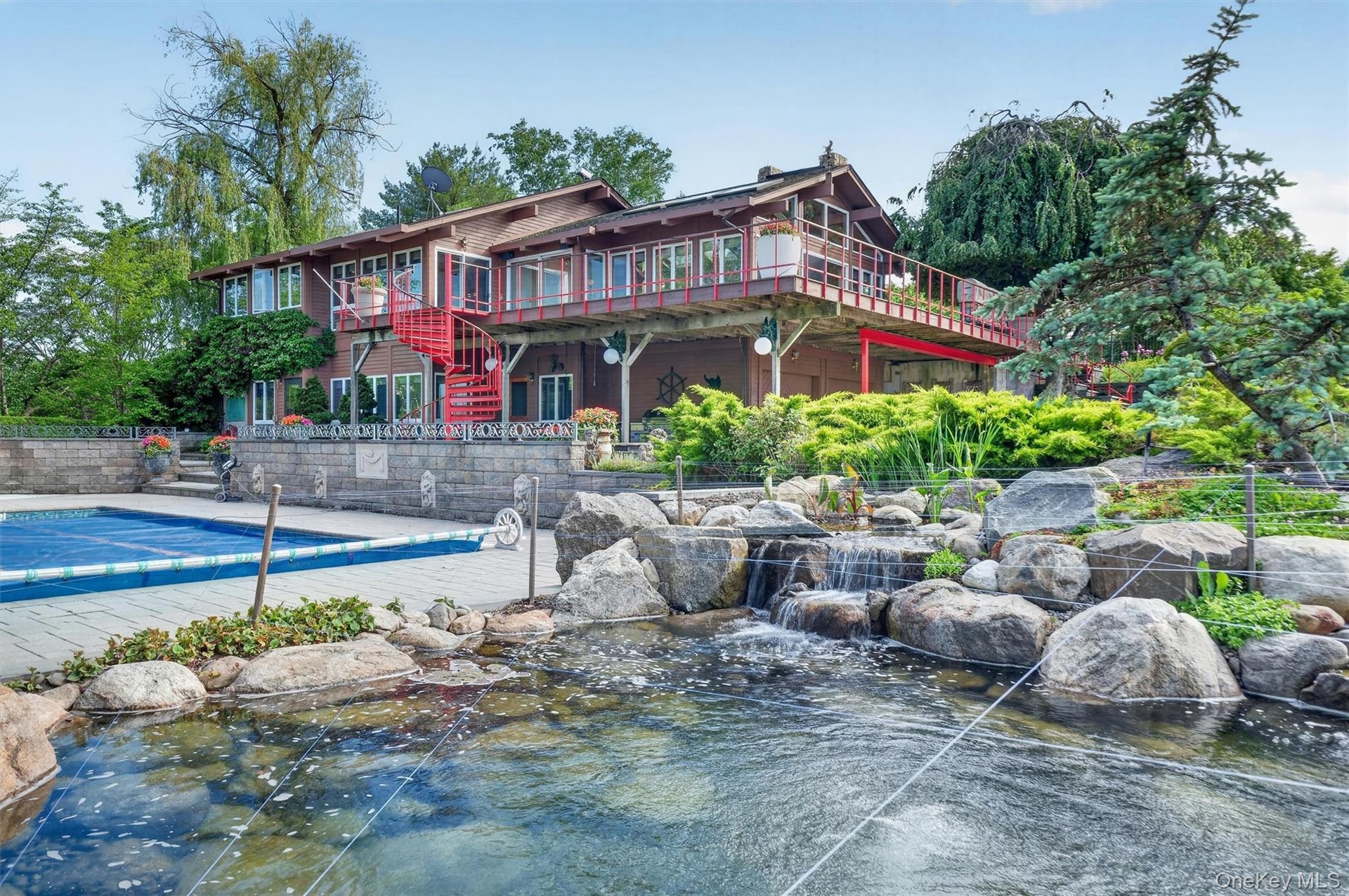 One of 3 koi ponds on the property bring a resort feel to the pool deck