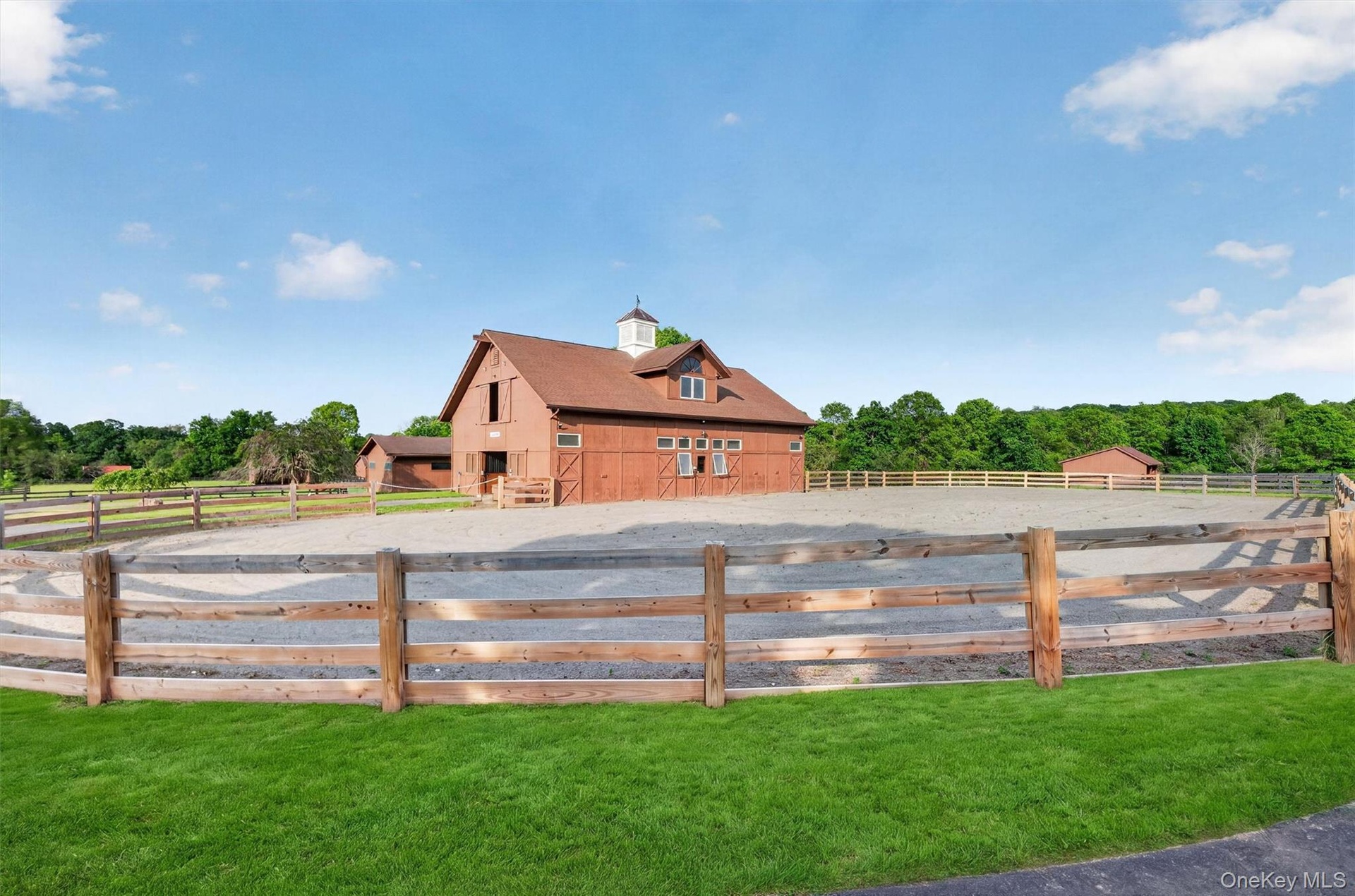4 board fencing surrounds the oval shaped stone dust ring