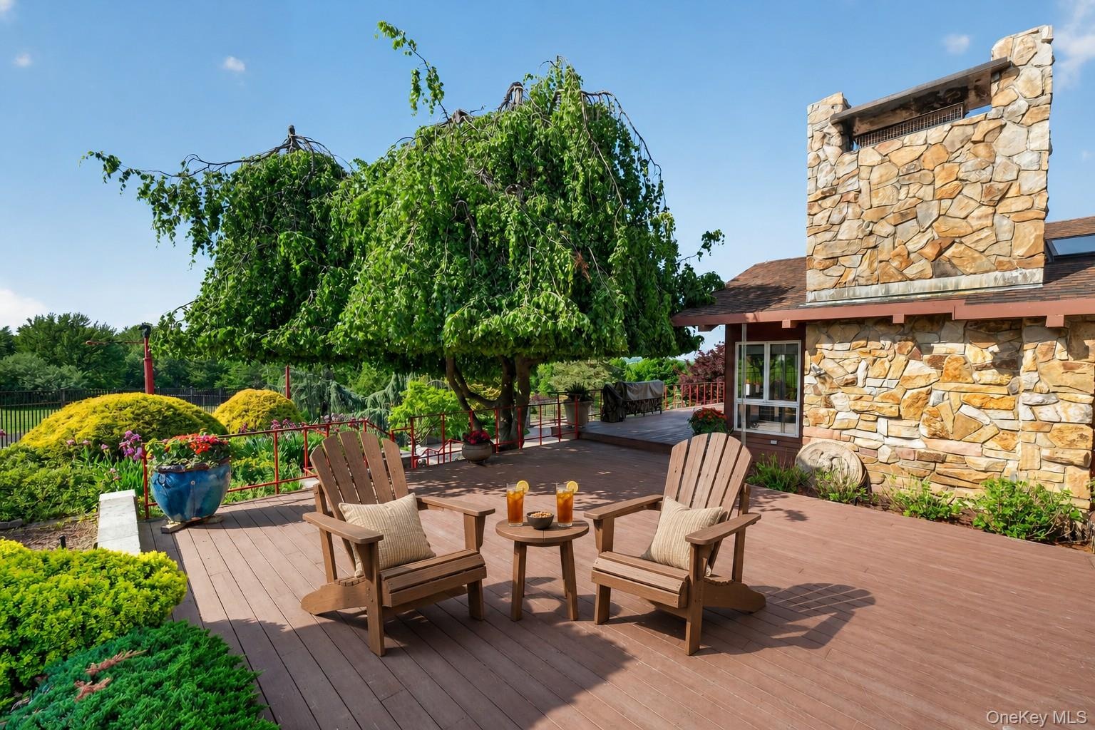 Enjoy the ample shade under the weeping birch, or one of the many ornamental trees on the property*virtually staged*