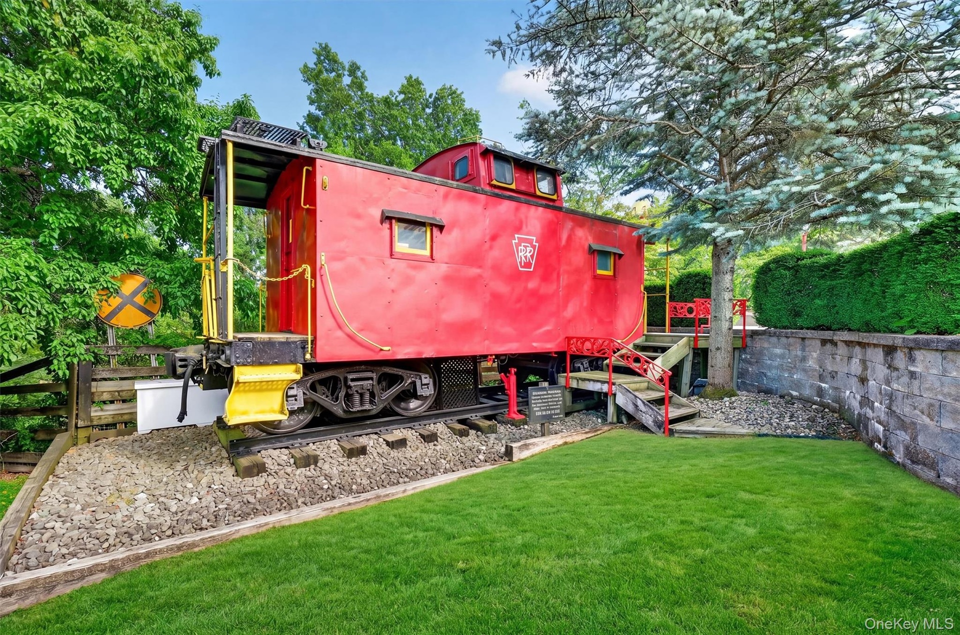 A genuine caboose from the Eastern shore of Virginia sits just below the pool deck and serves as a very cool pool house with seating and a kitchenette