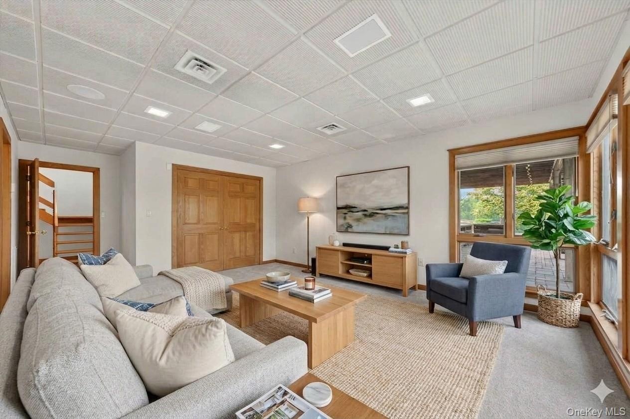 Lower level bedroom staged as a living area*virtually staged*