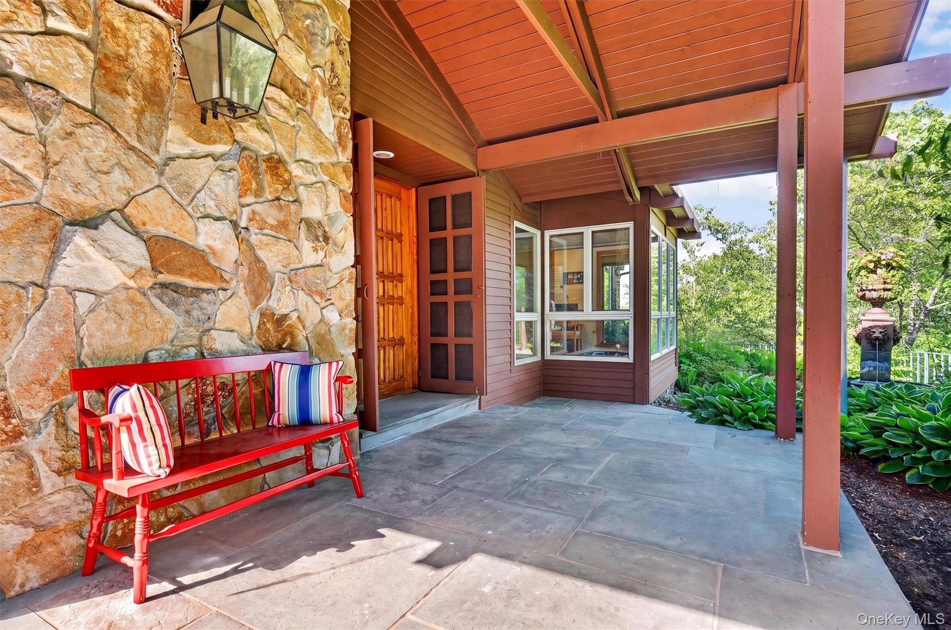 Wood, slate and stone entrance contribute to the rustic vibe