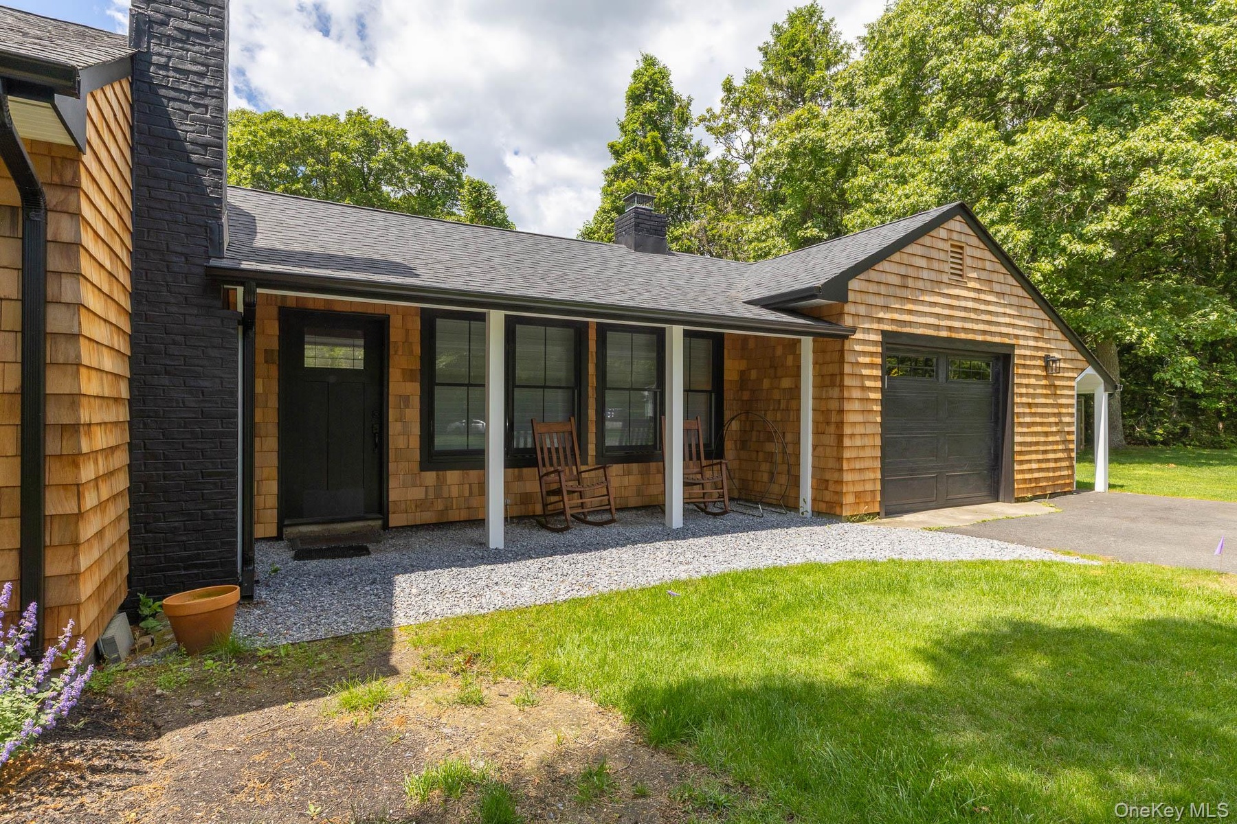 Spacious front yard with overside garage