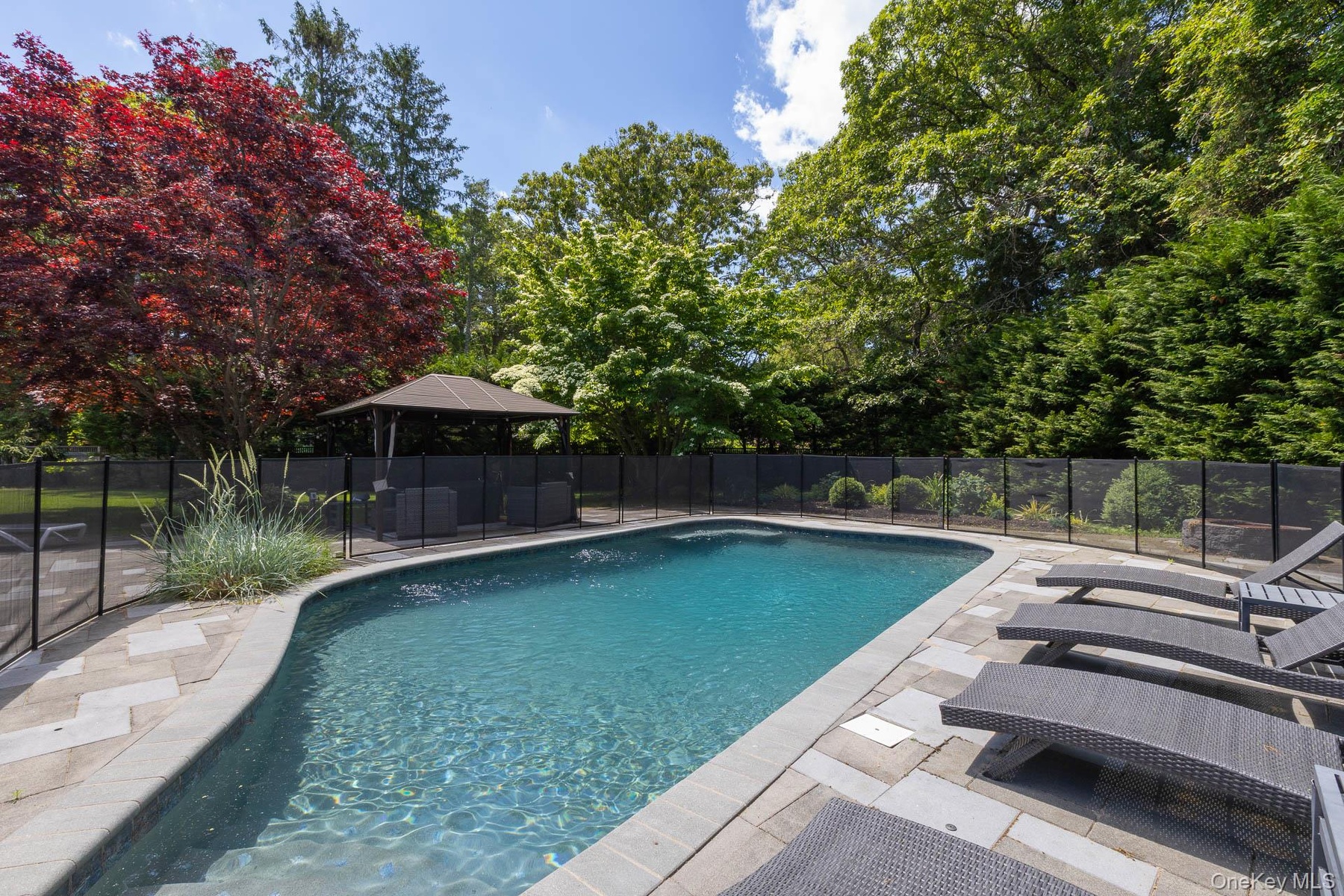 Country club back yard with in ground and fire pit