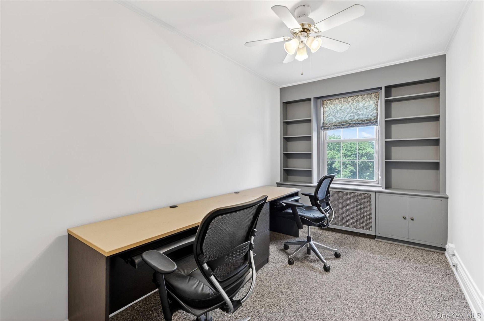 Bedroom #2 used as an office with Built-Ins and Closet with Custom Shelving