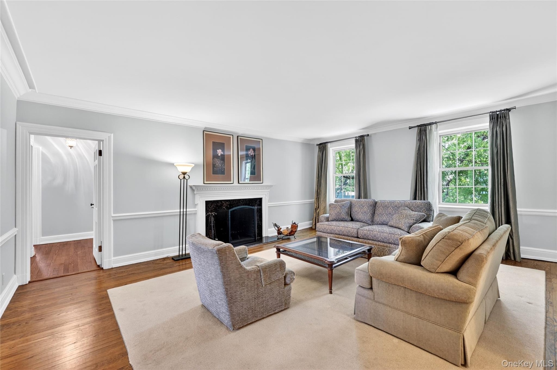 The Living Room offers generous space with a wood burning fireplace