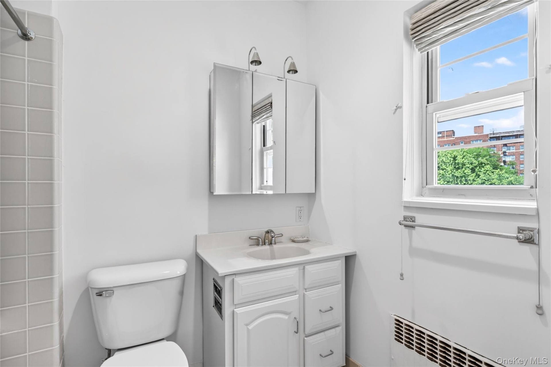 Primary Bathroom offers a bath with shower