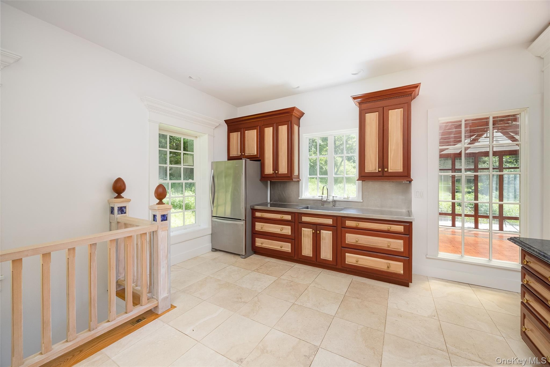 Kitchen with granite countertops and custom hard wood cabinets