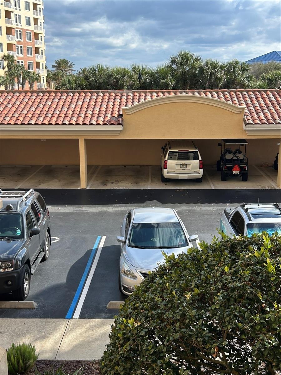 Reserved carport across from front door to lobby.