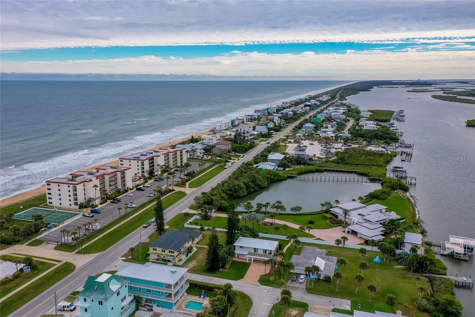 A stunning overview of the neighborhood reveals the property’s unbeatable setting between the Atlantic Ocean and Indian River, with nearby public dock