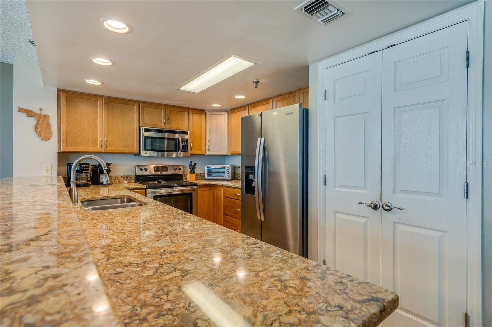 Stainless steel appliances and abundant cabinetry make this kitchen as functional as it is stylish.