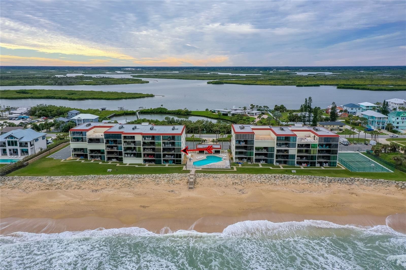 A sweeping ocean-facing view captures the full layout of the development, showcasing both the Atlantic beachfront and lush inland waterways beyond.