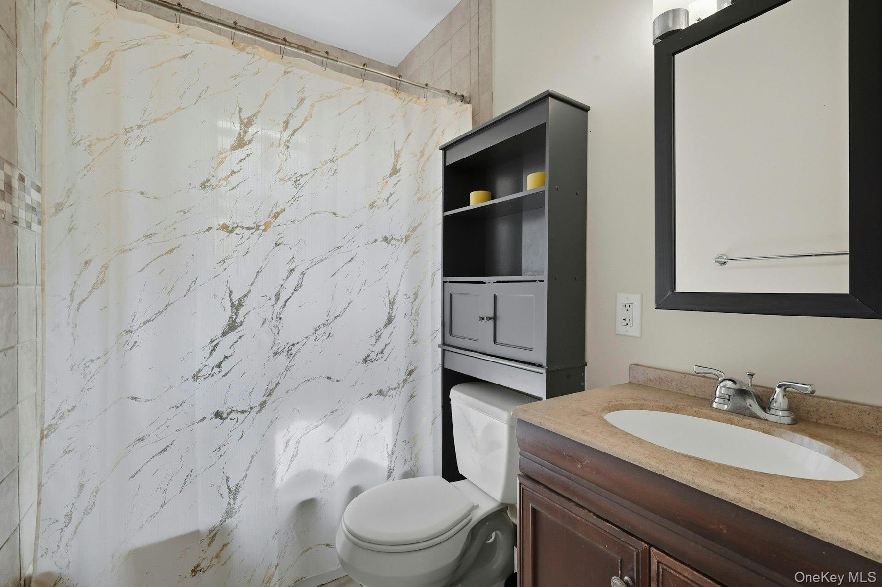 Bathroom featuring vanity and tub/ shower bath