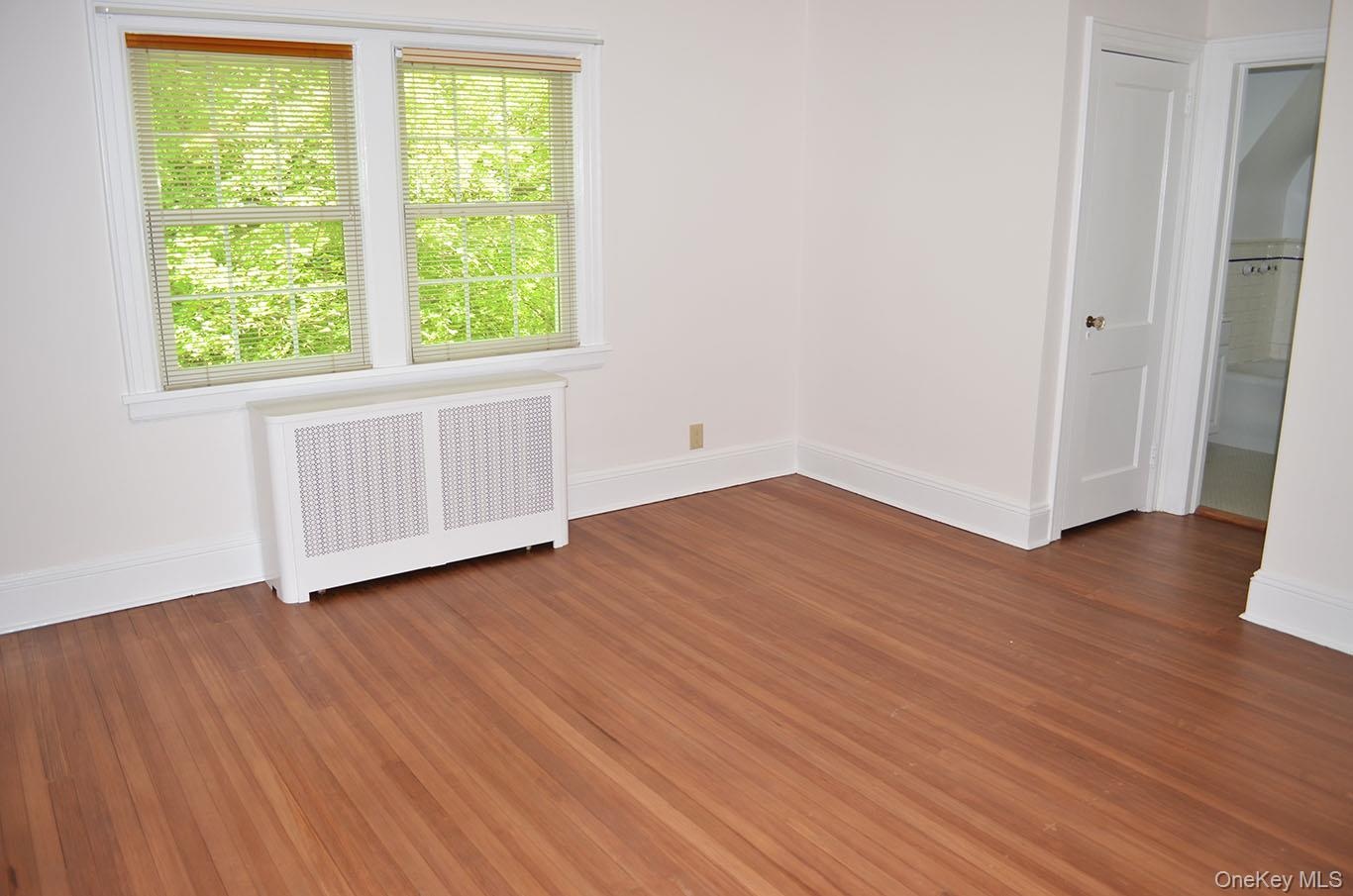 Spacious primary bedroom with two closets and full bath