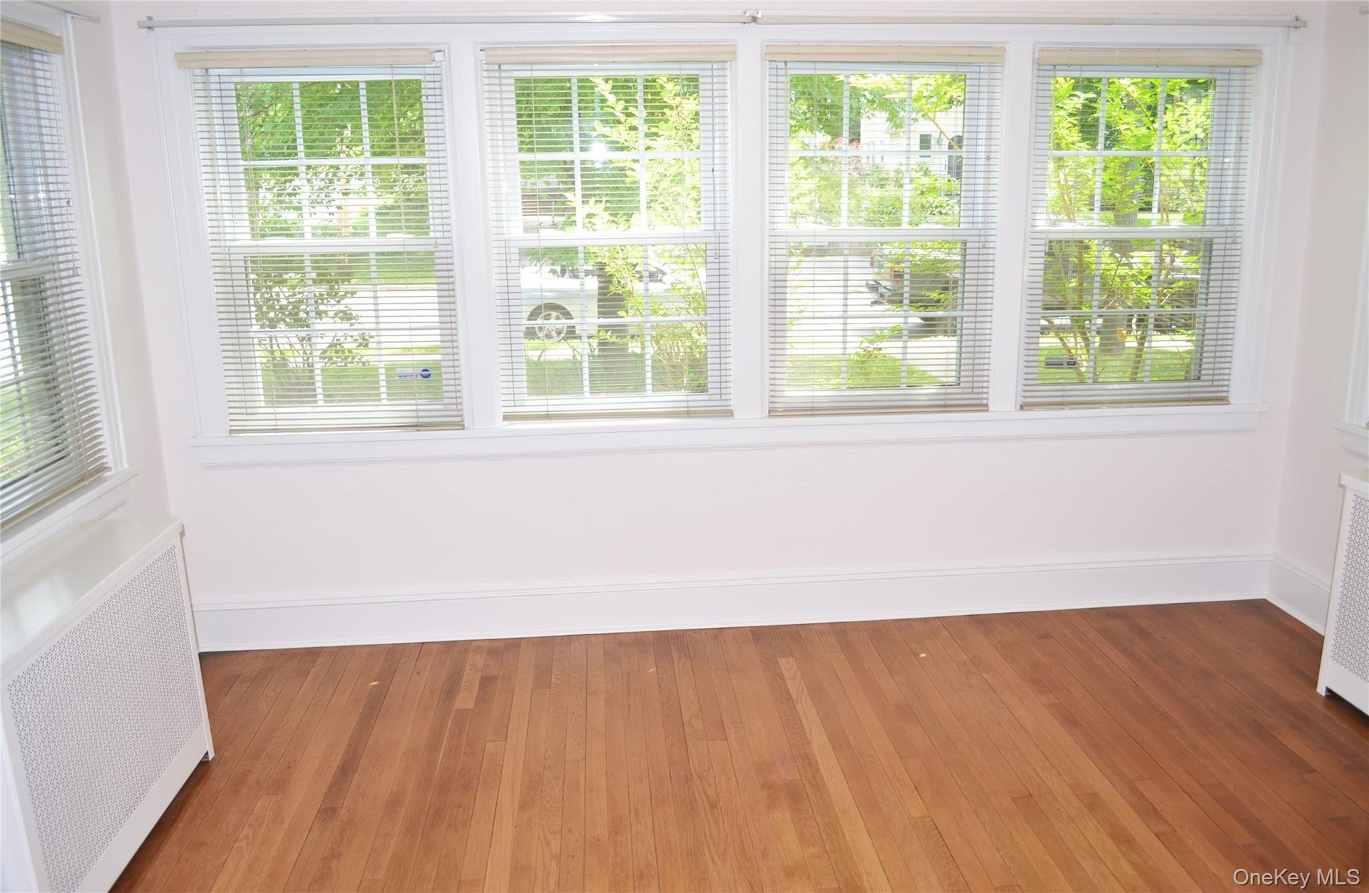 Sun filled den with hardwood floors