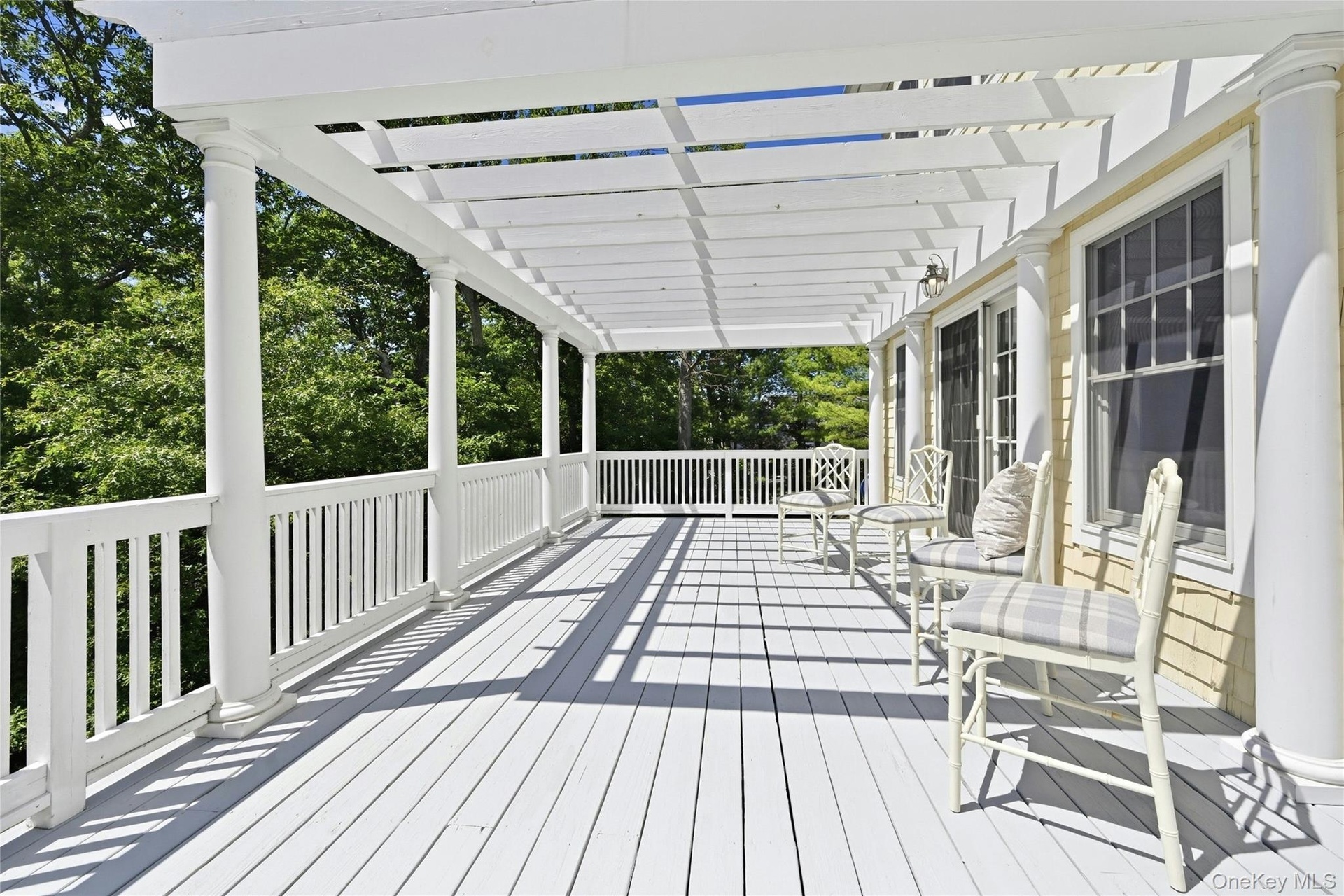 French Doors From Kitchen to Outside Deck with New Pergola