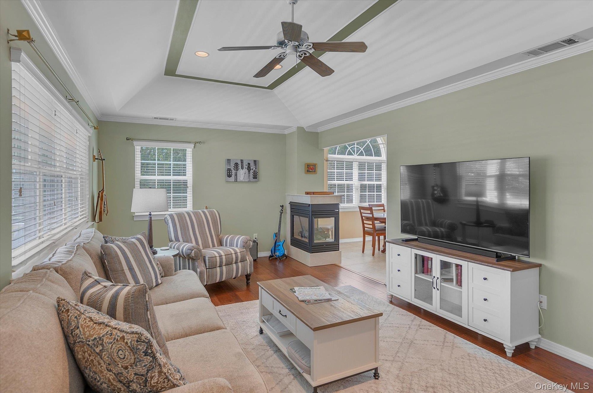 Lots of natural light. Trey Ceiling. Wood Floors. Gas Fireplace.