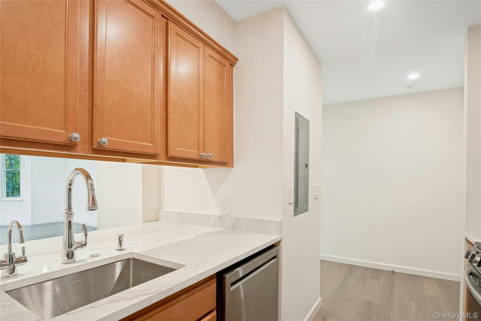 Kitchen featuring Kohler faucet with pull down spray, sink with hot water dispenser and new dishwasher
