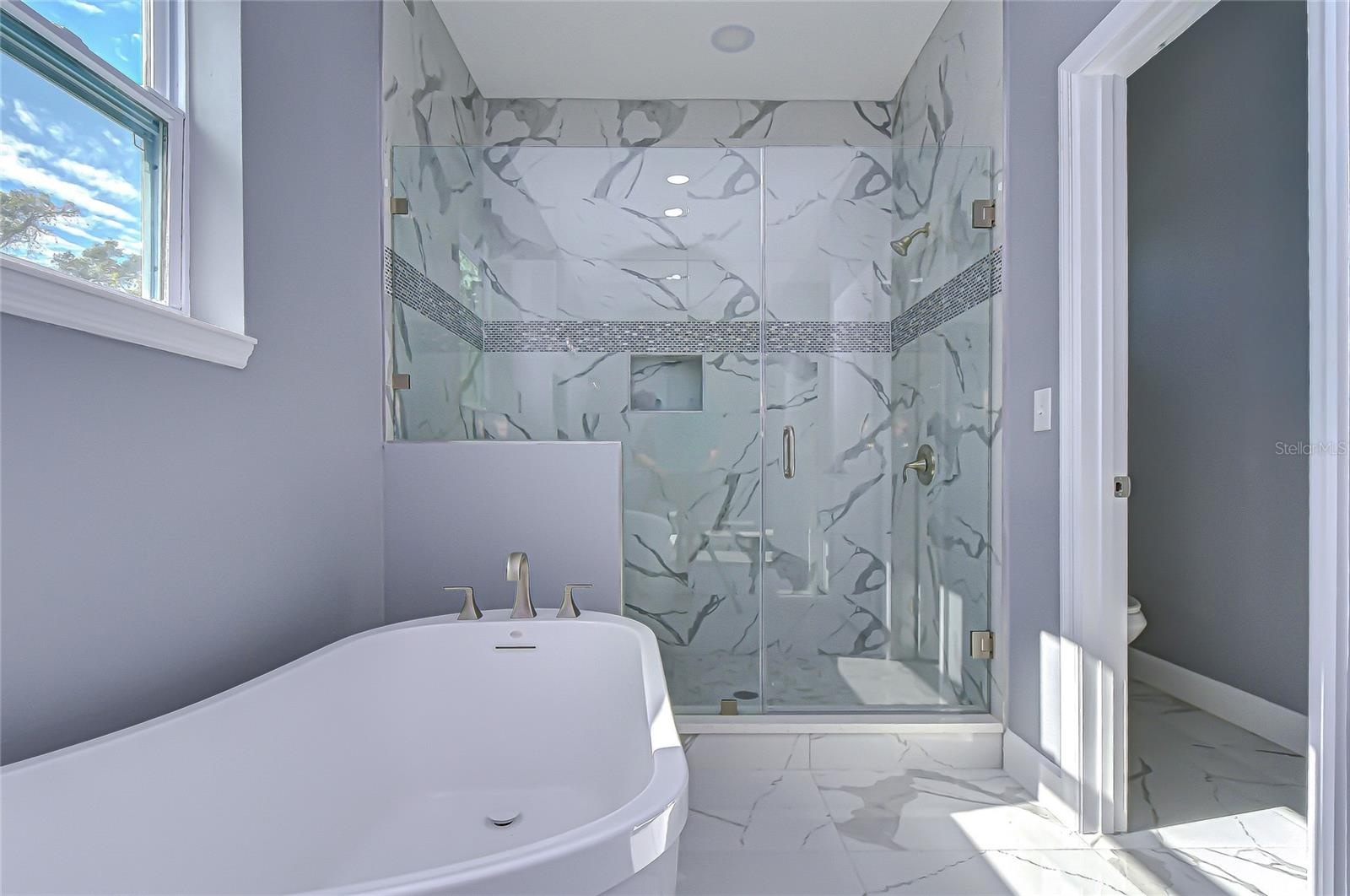 Primary bath w/ similar finishes