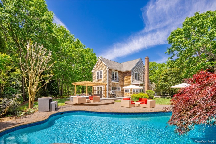 Inviting in-ground swimming pool with a paved surround