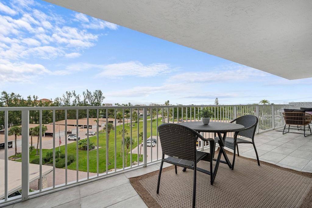 Large terrace overlooks beautfully landscaped grounds