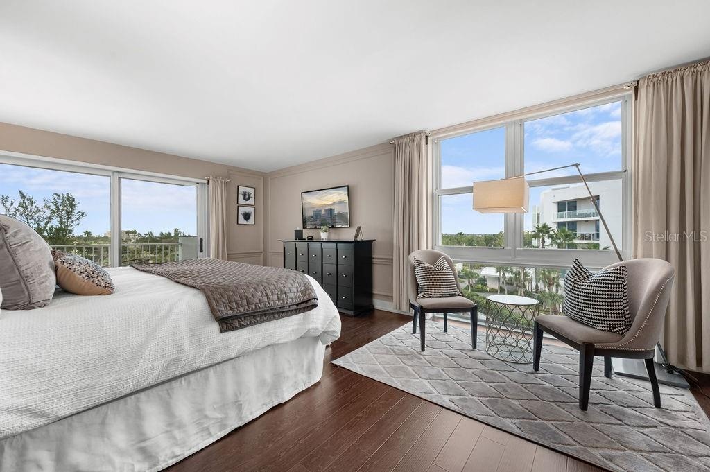 Primary Suite hosts a king size bed and space for a sitting area.