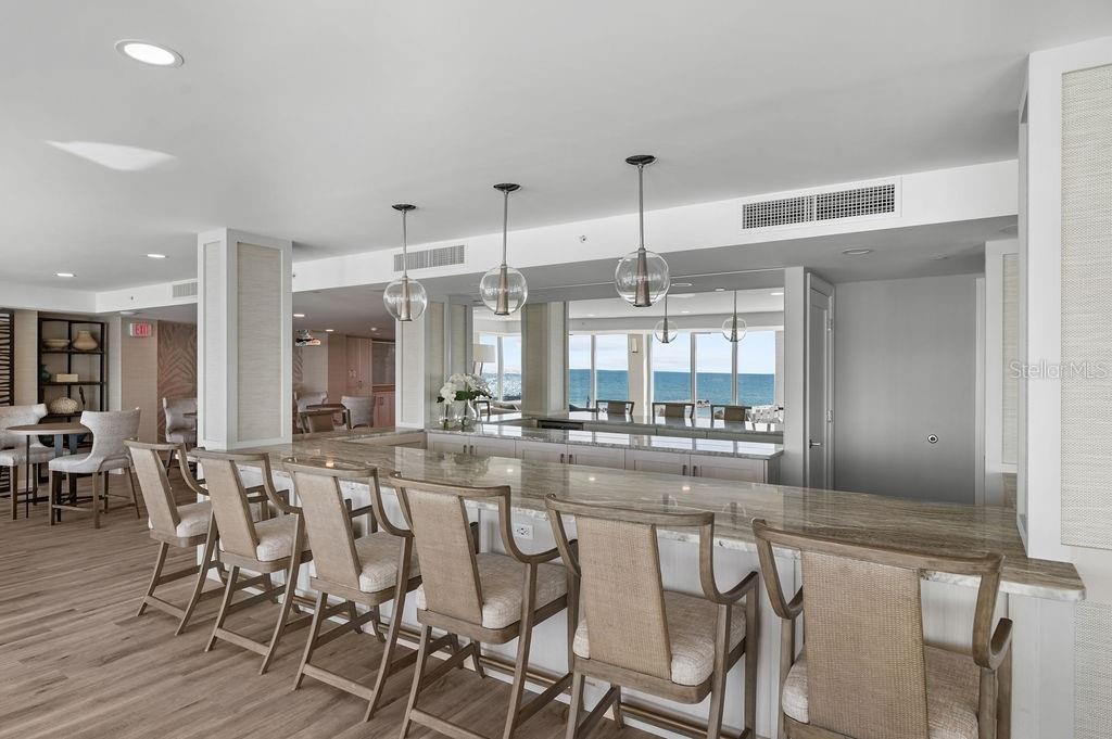 The Club Room offers a full kitchen, seating abd dining areas, a library and game area.