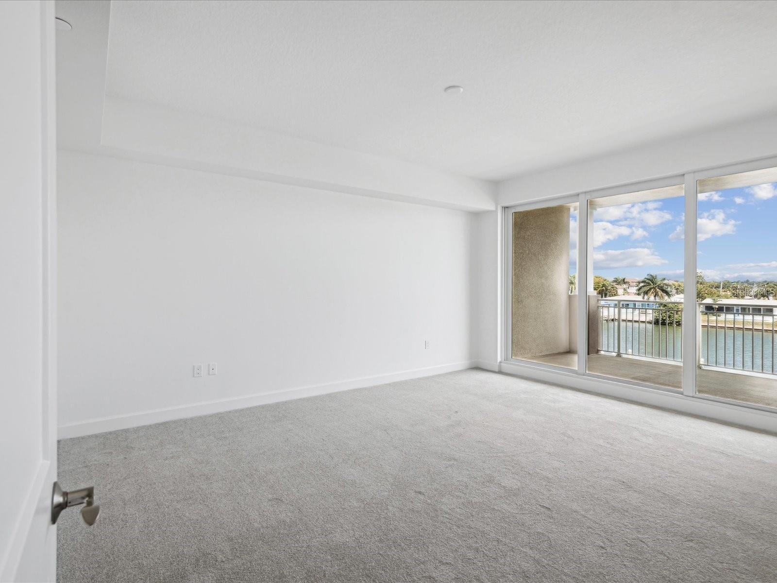 Primary bedroom Sliding door to balcony