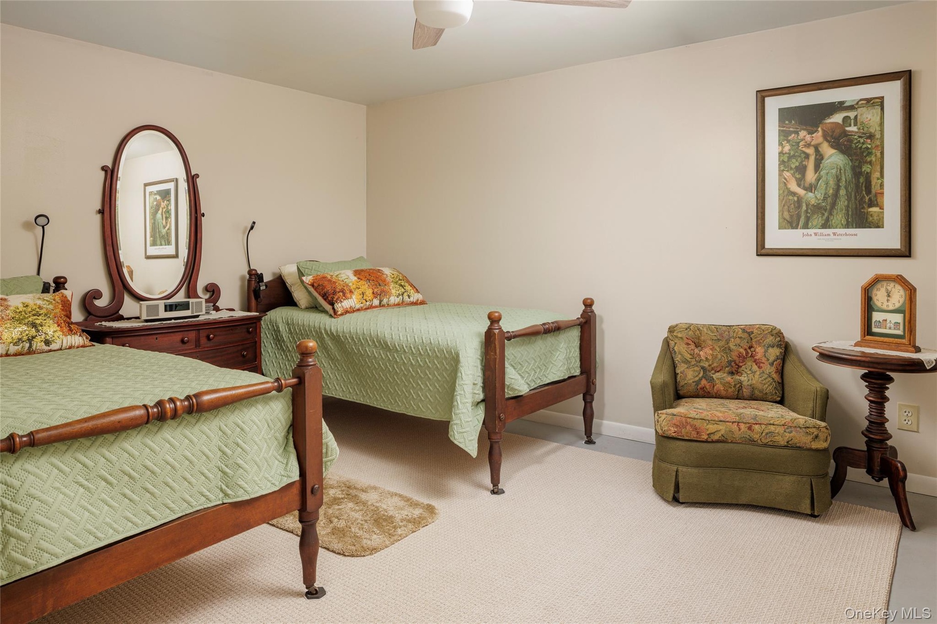 Carpeted bedroom featuring ceiling fan and baseboards