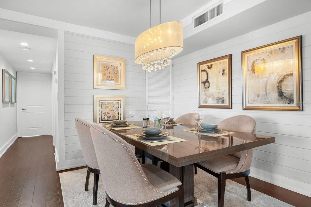 The dedicated dining area offers upgraded lighting that enhances the overall ambiance yet maintains a comfortable, casual feel.