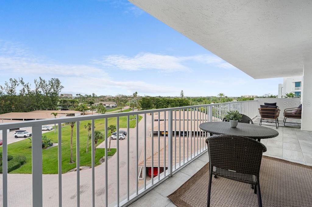 Large terrace overlooks beautfully landscaped grounds
