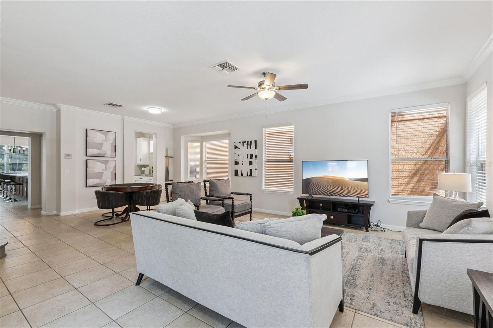Font living room with poker and bumper-pool table, tv and entertainment space
