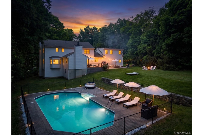 Stunning backyard with pool and lots of entertaining spaces.
