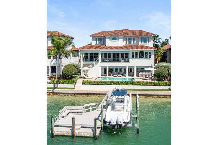 Spectacular deep-water view from your private pool/spa, dual lanais, custom outdoor kitchen or boat dock with 13,000lb boat lift& 75' waterfront