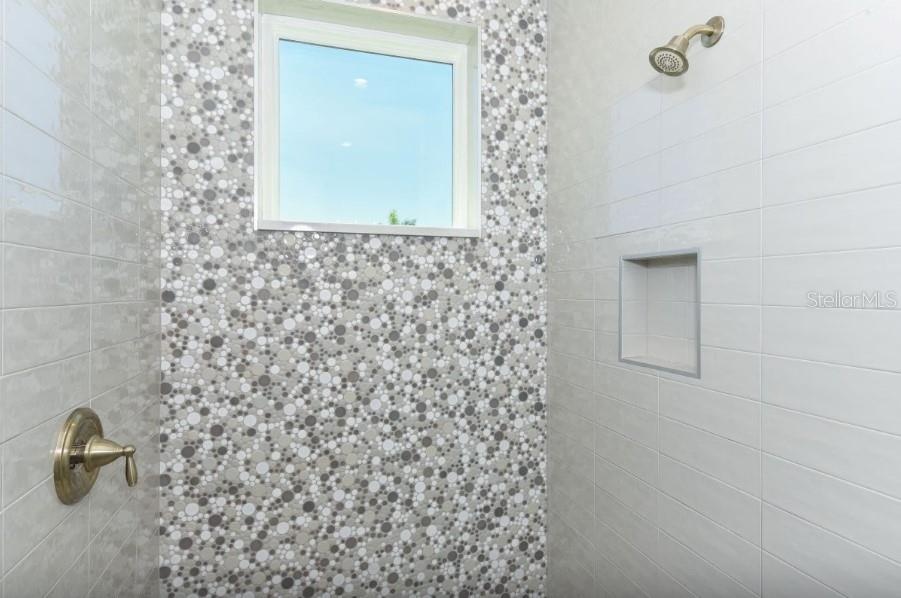 Bedroom #3 en suite bathroom with walk in tile shower