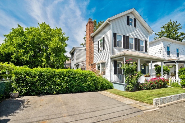 Front porch with large driveway