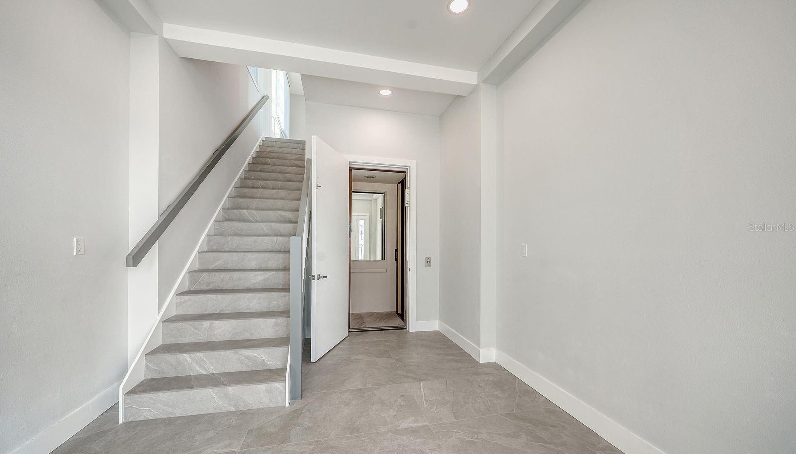 Foyer features beautiful porcelain tile flooring