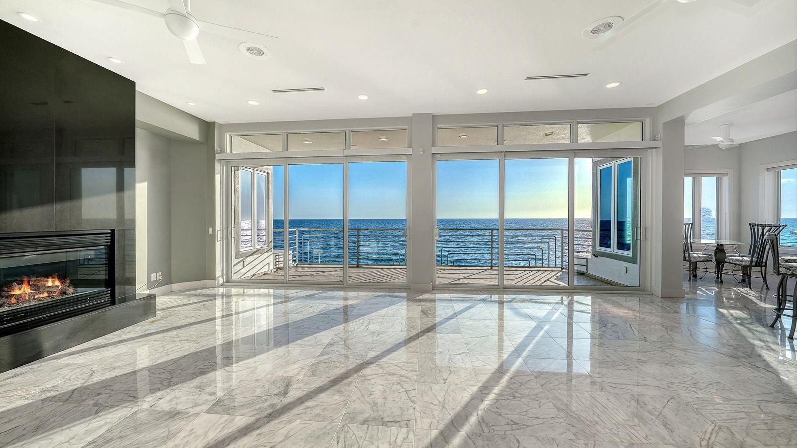 Living room with marble floors and fireplace